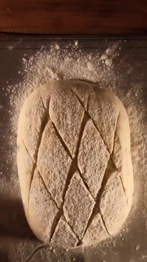 Hand-scored artisan sourdough bread ready for the oven, Moi Doughssier Vashi